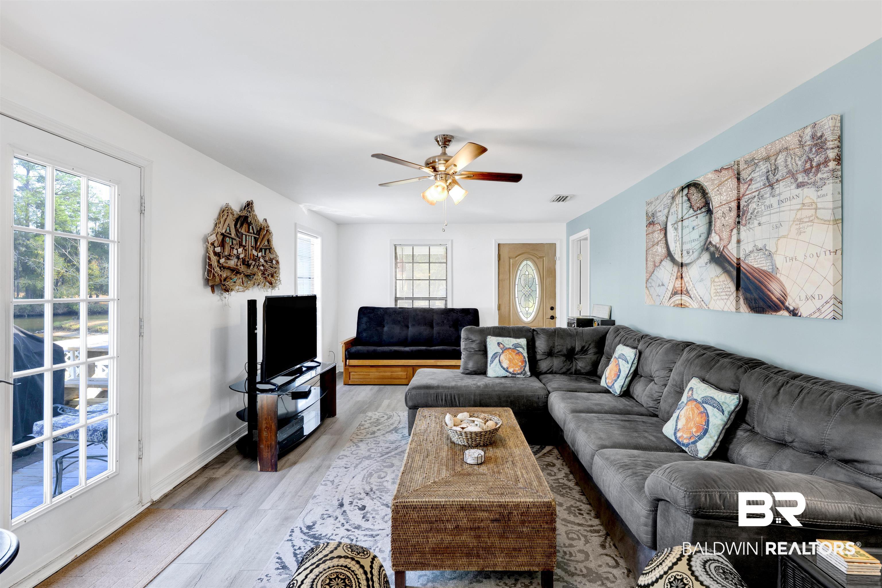 23770 Miflin Road Elberta, AL 36530 - Photo 4 of 38 Living room featuring ceiling fan and light wood-style flooring