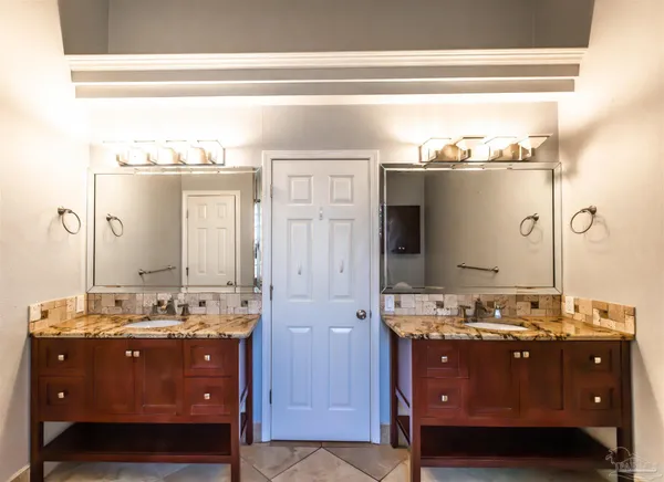 a bathroom with a tub and shower