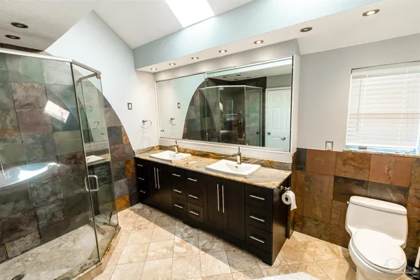 a bathroom with a tub and shower