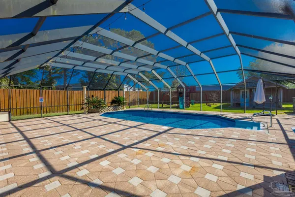 a view of a backyard with sitting area