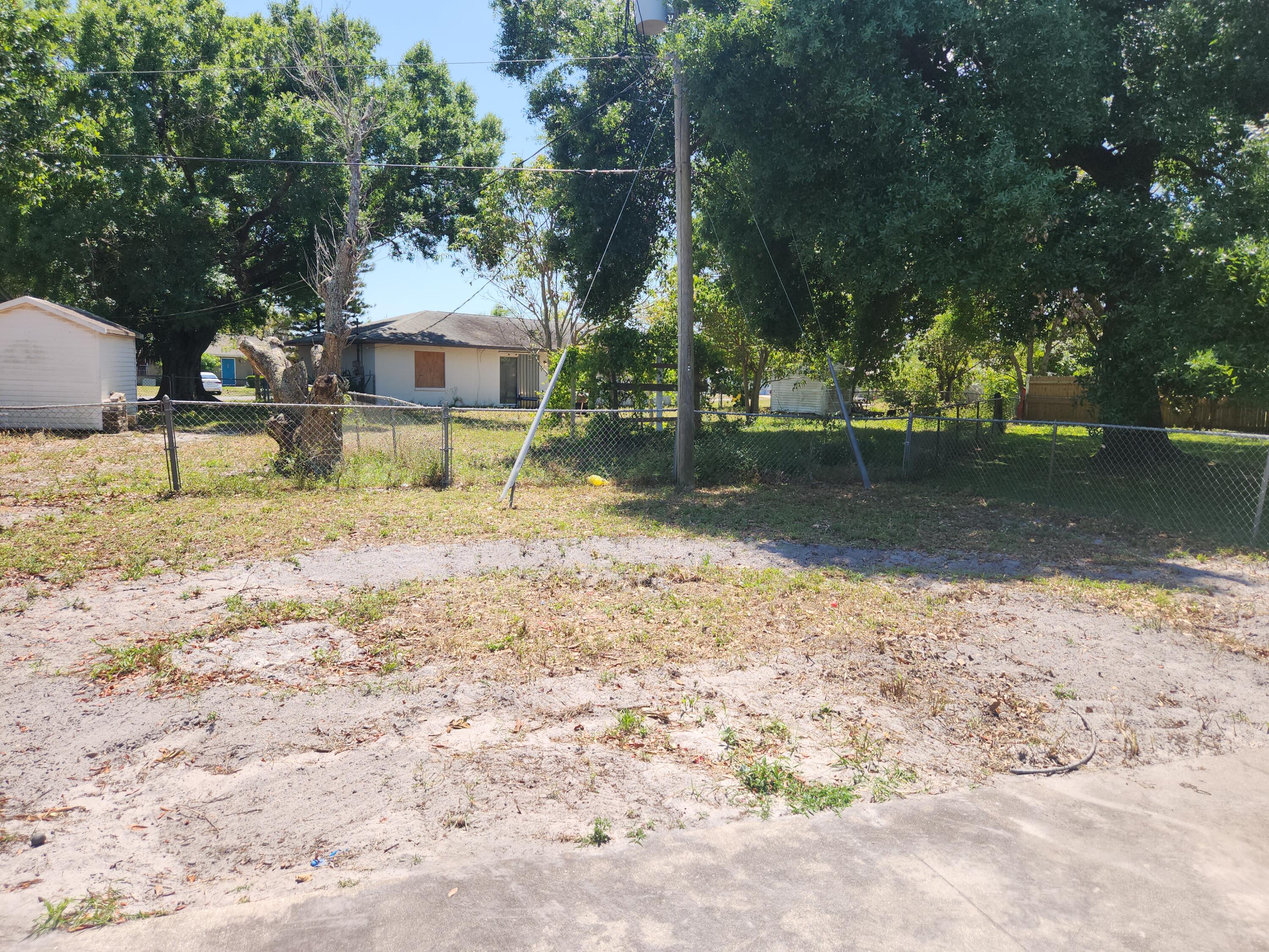 951 Palm Street Cocoa, FL 32927 - Photo 11 of 34 front view of a house with a yard