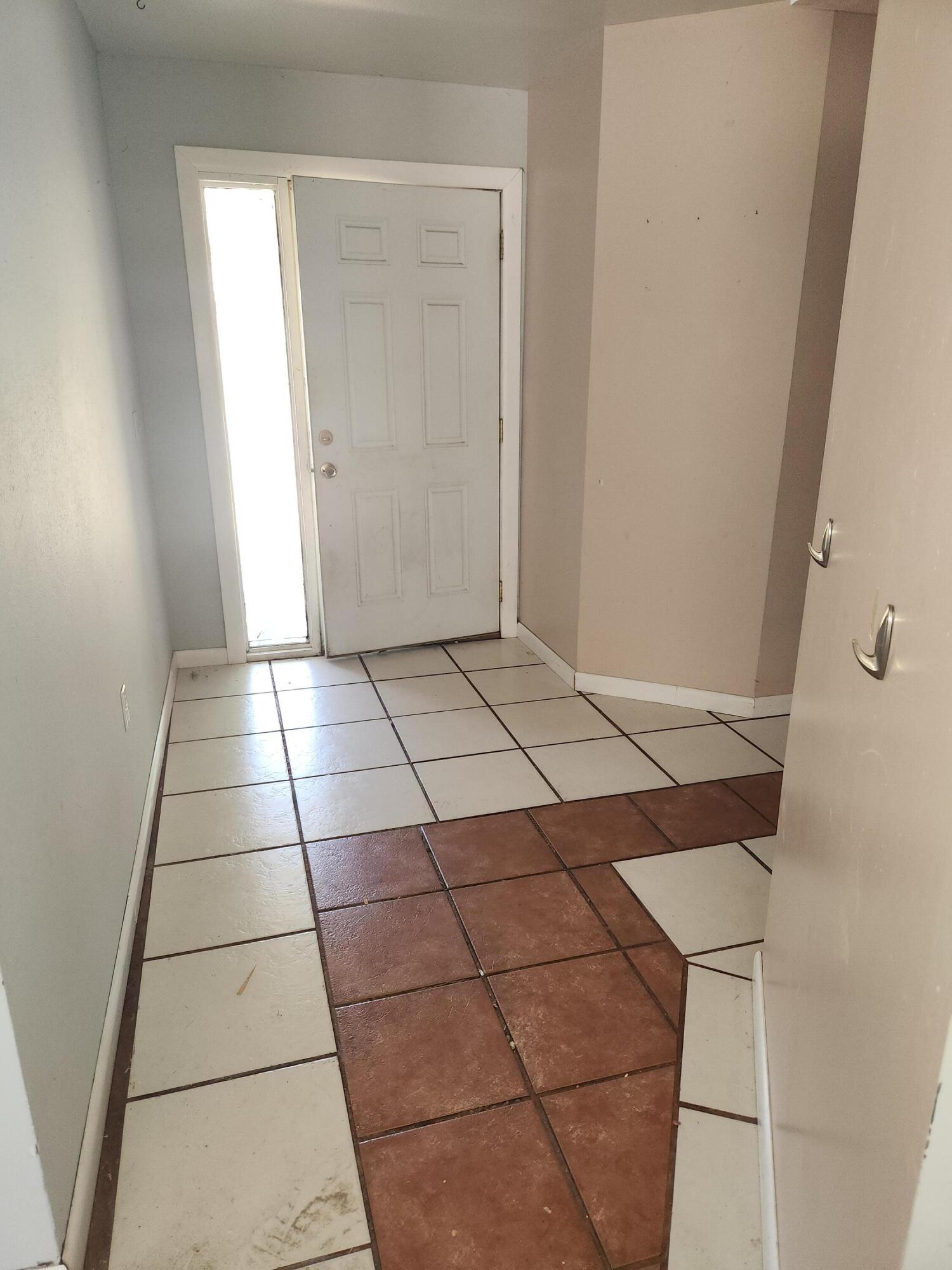 951 Palm Street Cocoa, FL 32927 - Photo 12 of 34 a view of a livingroom with an empty space and a window