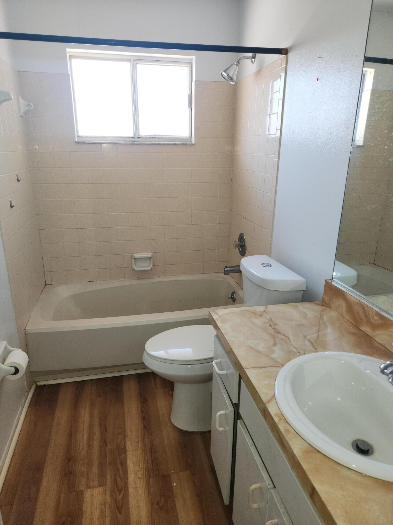 951 Palm Street Cocoa, FL 32927 - Photo 20 of 34 a bathroom with a sink a toilet and shower