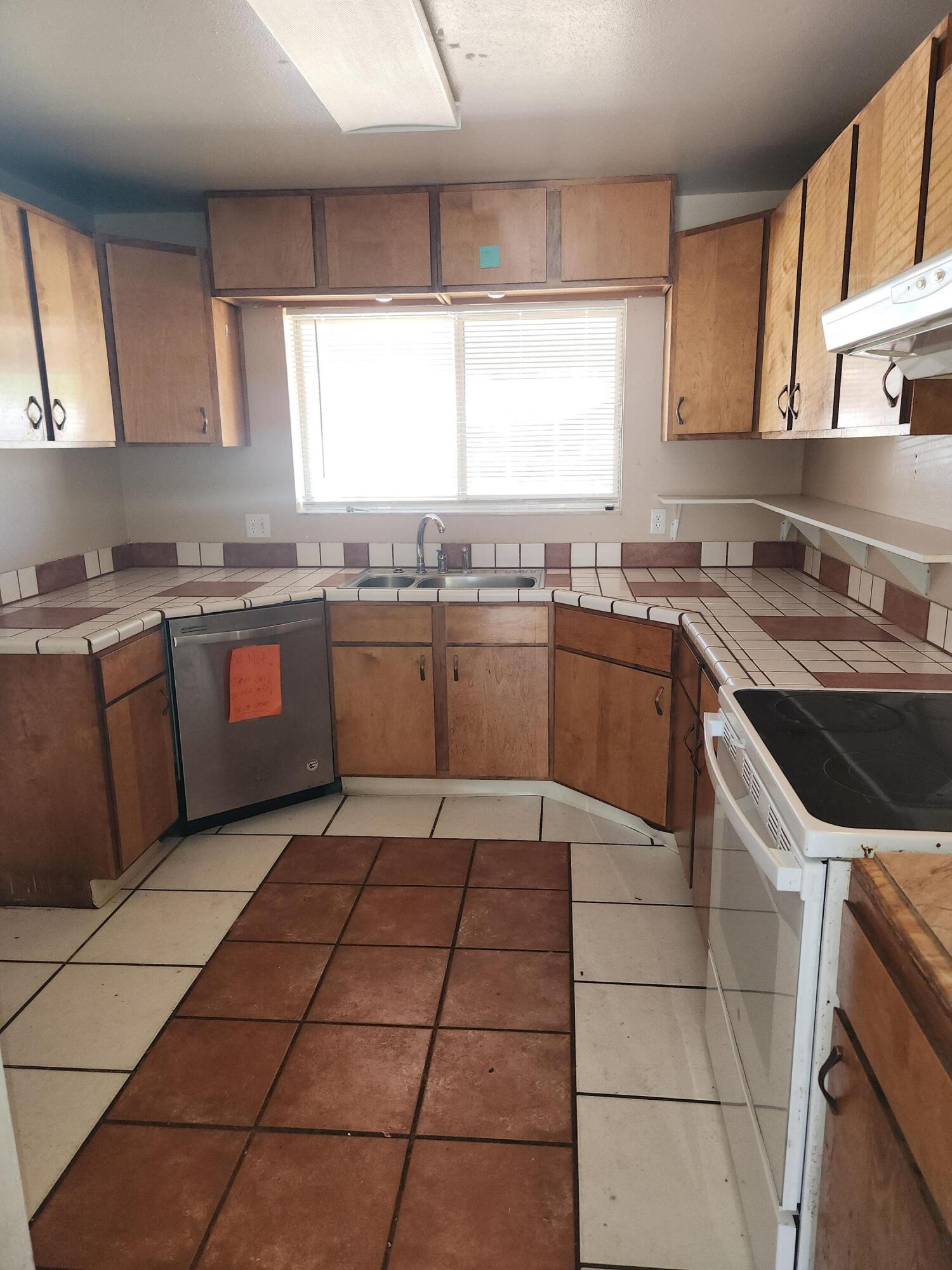 951 Palm Street Cocoa, FL 32927 - Photo 2 of 34 a kitchen with stainless steel appliances granite countertop sink stove top oven and cabinets
