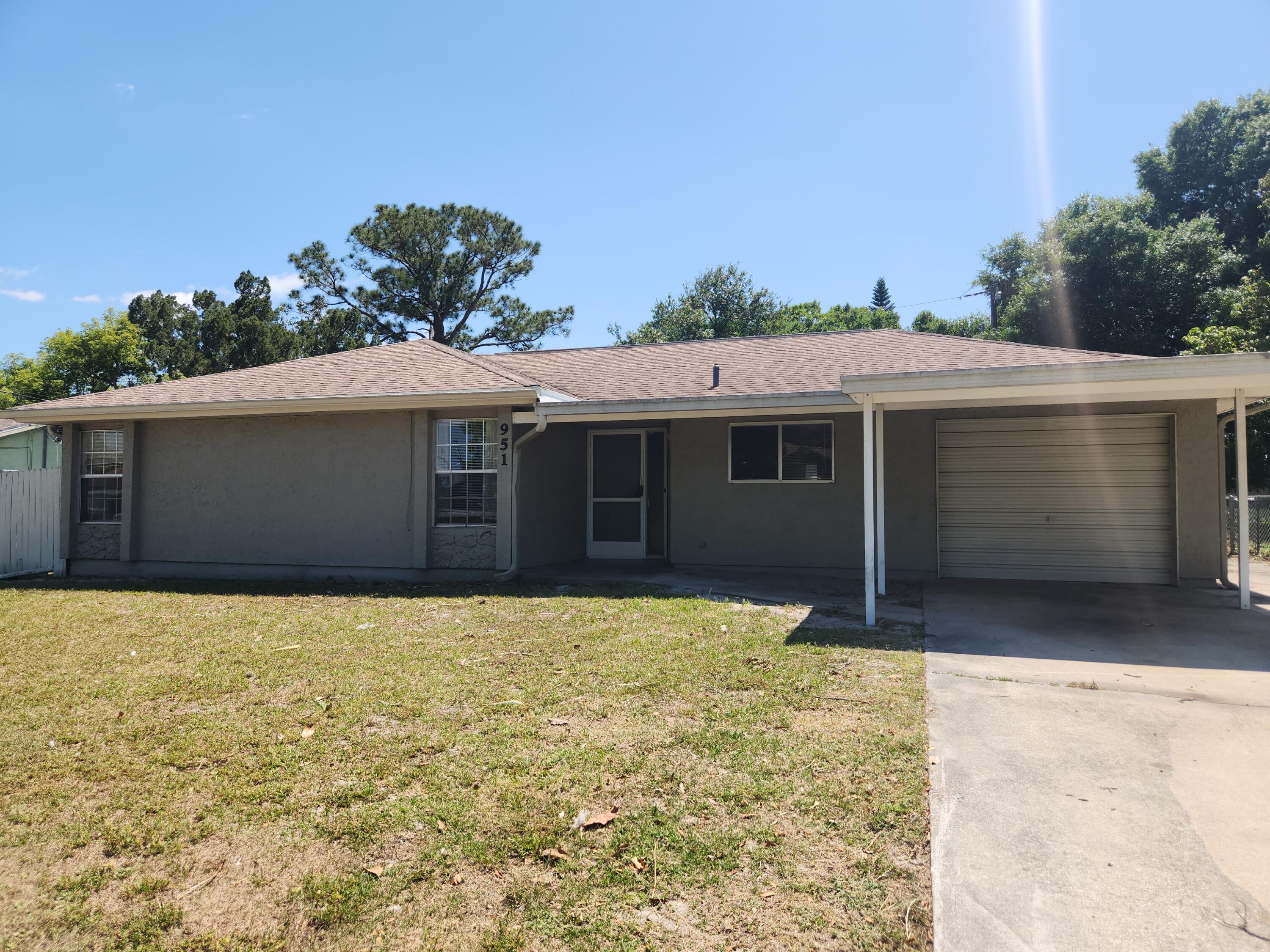 951 Palm Street Cocoa, FL 32927 - Photo 21 of 34 a front view of a house with a yard