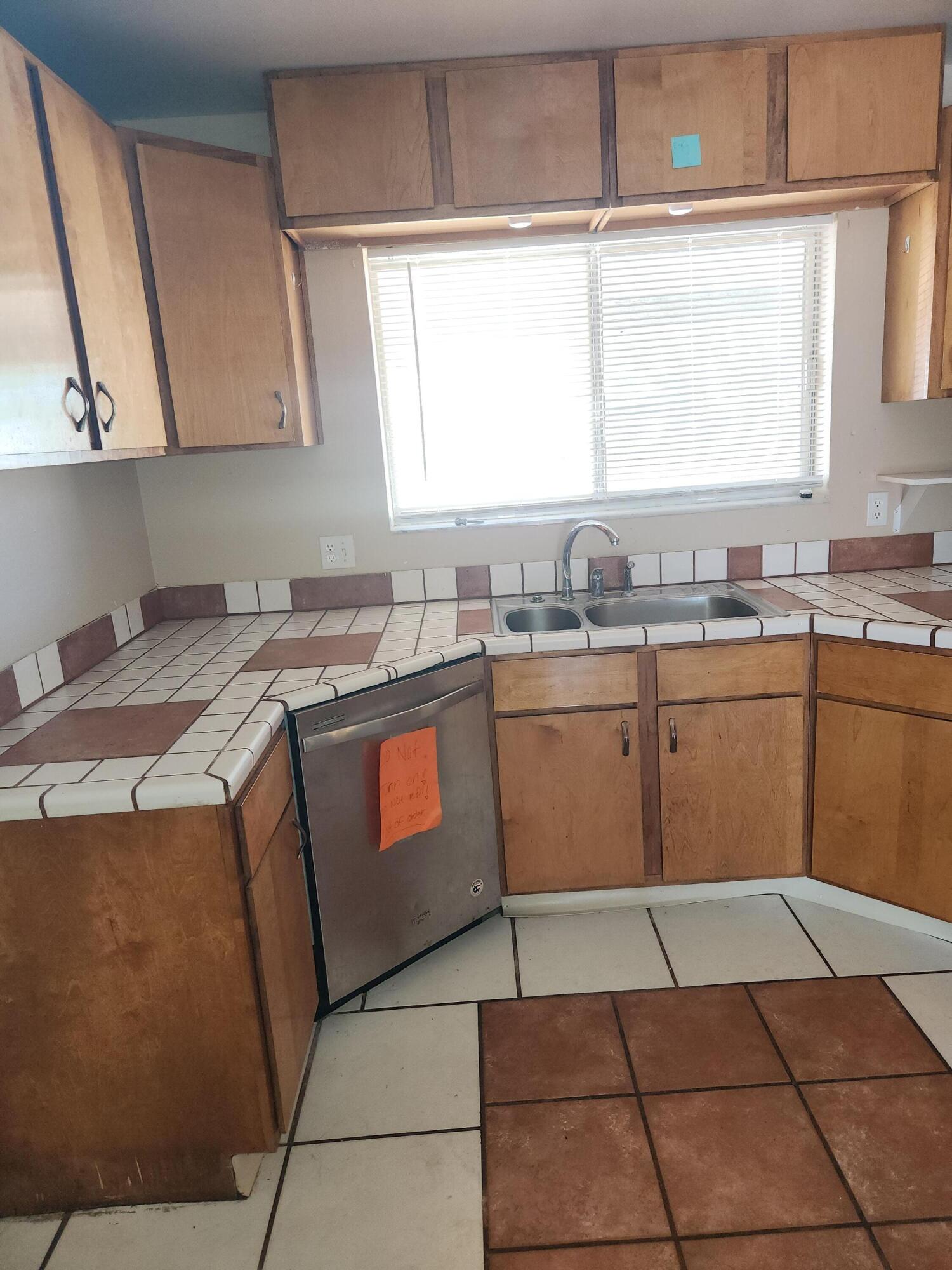 951 Palm Street Cocoa, FL 32927 - Photo 6 of 34 a kitchen with a sink window and cabinets
