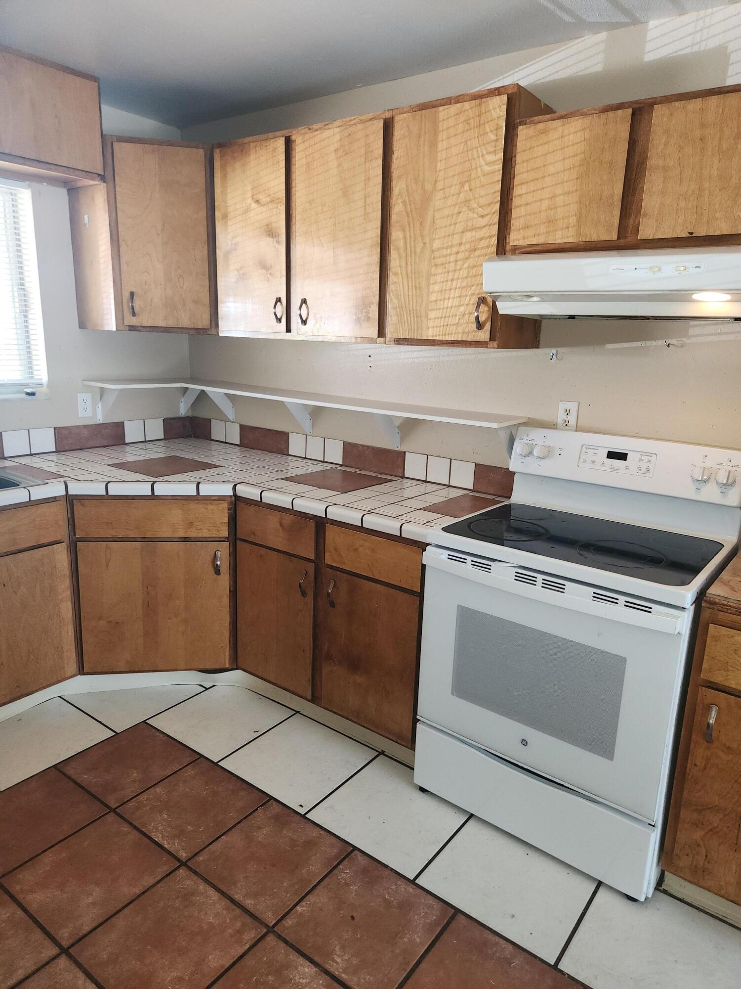 951 Palm Street Cocoa, FL 32927 - Photo 7 of 34 a kitchen with a stove sink and cabinets