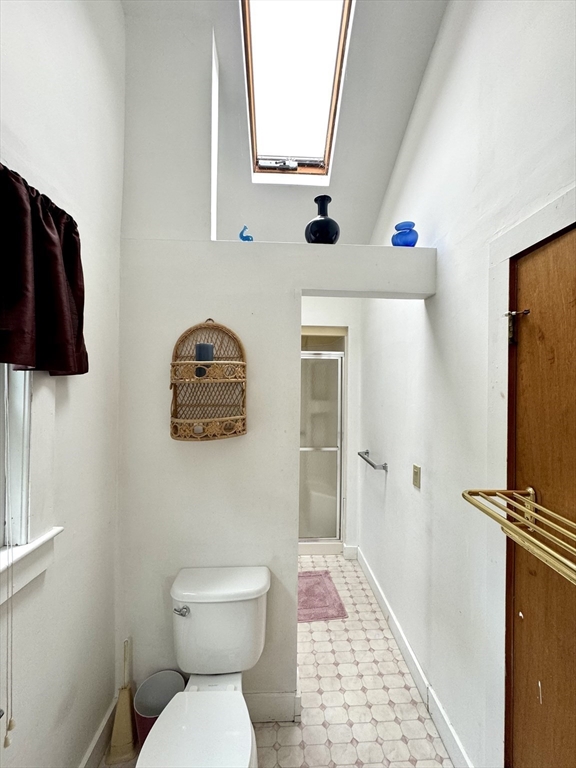 24 Shore Road West Dennis, MA 02670 - Photo 19 of 28 a bathroom with a toilet a sink and mirror