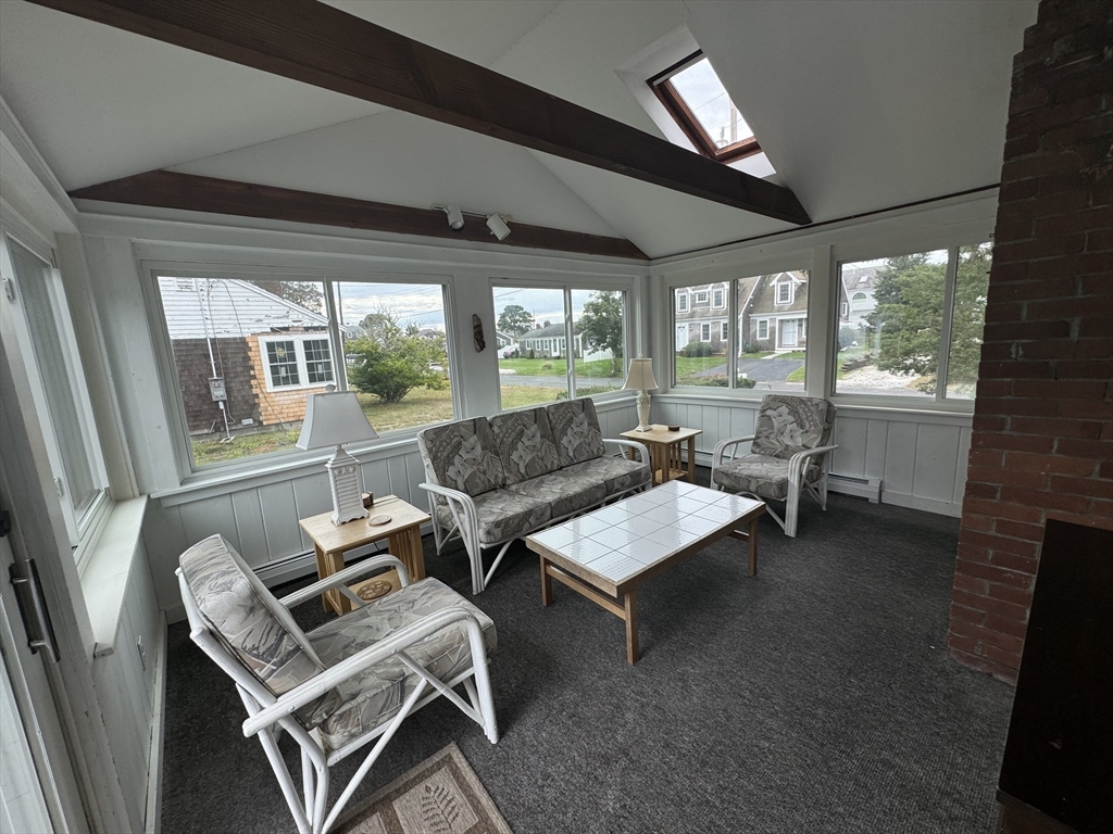 24 Shore Road West Dennis, MA 02670 - Photo 9 of 28 a living room with furniture and a window