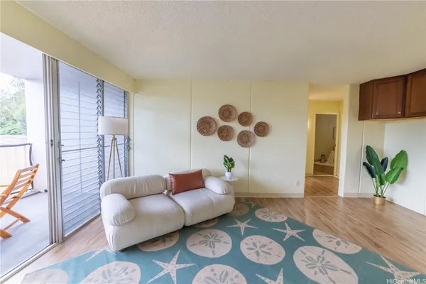 a living room with furniture and a rug