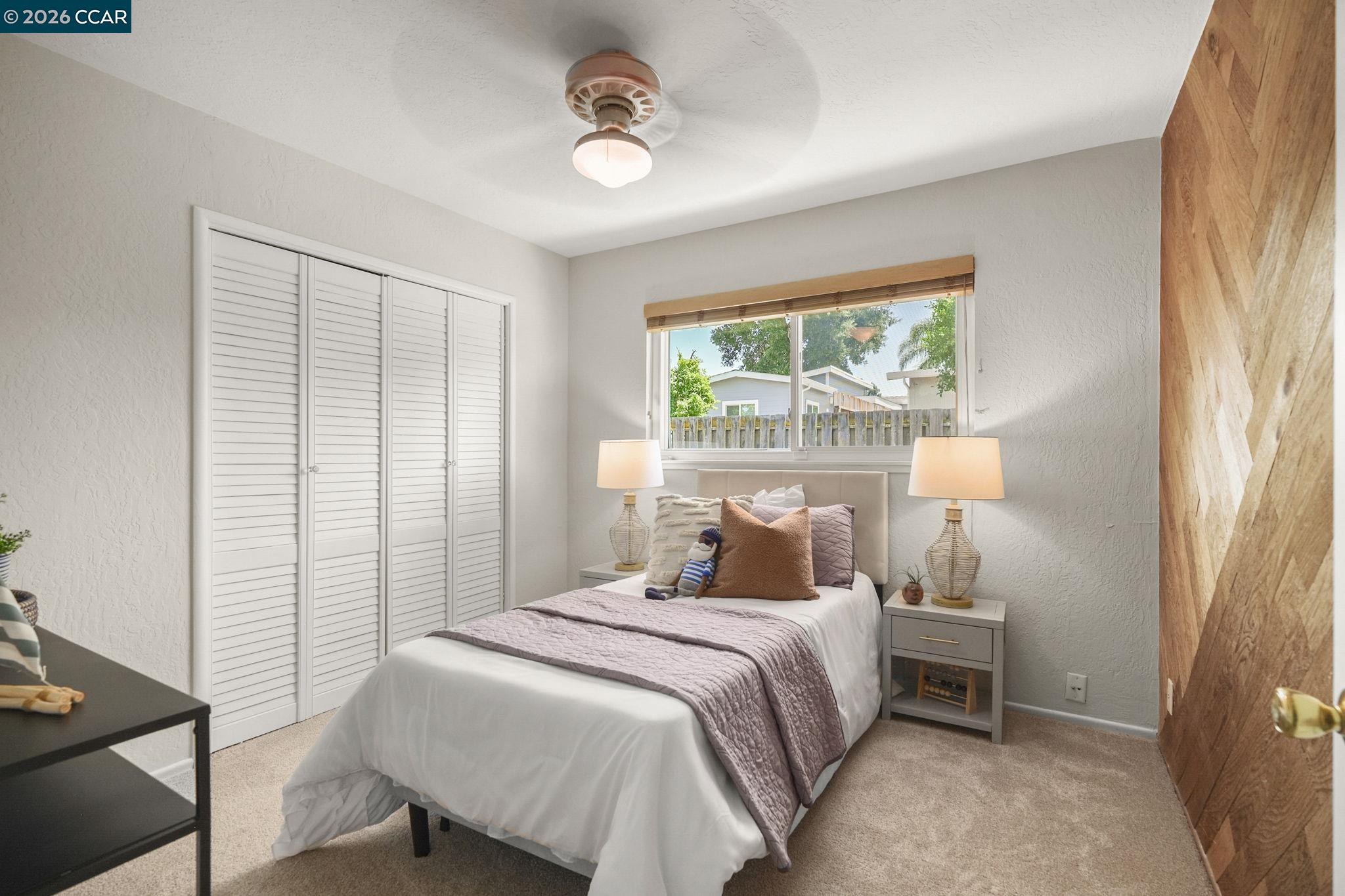 4311 Cowell Road Concord, CA 94521 - Photo 19 of 29 a bedroom with a bed and a large window