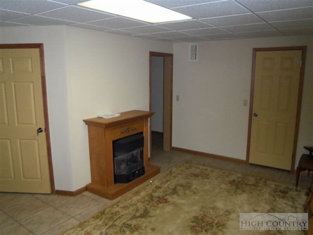 727 Teaberry Road Warrensville, NC 28693 - Photo 15 of 15 a room with a fireplace