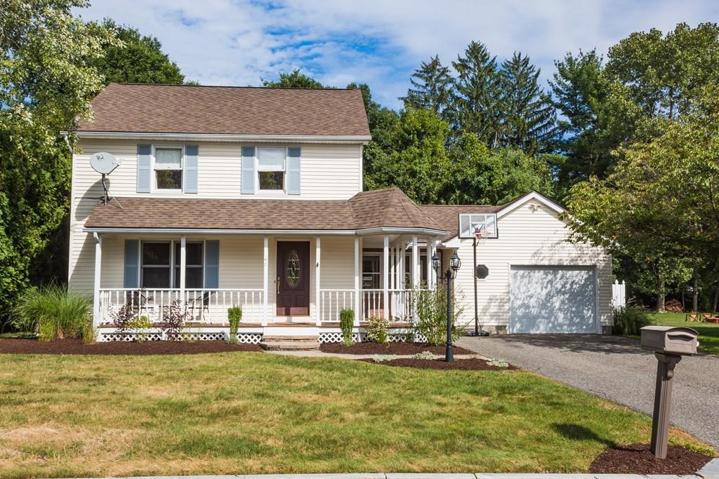 a front view of a house with a yard patio and fire pit