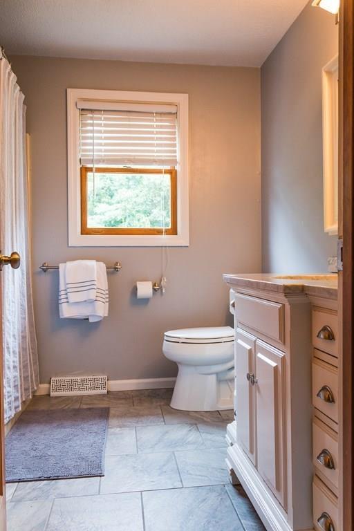 45 Winterset Drive Springfield, MA 01129 - Photo 12 of 21 a bathroom with a toilet a sink and a window
