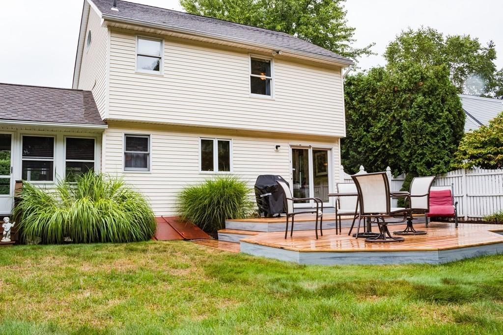 45 Winterset Drive Springfield, MA 01129 - Photo 18 of 21 a view of a backyard with a patio table and chairs