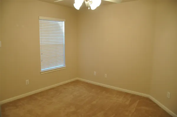 an entryway with wooden floor and door