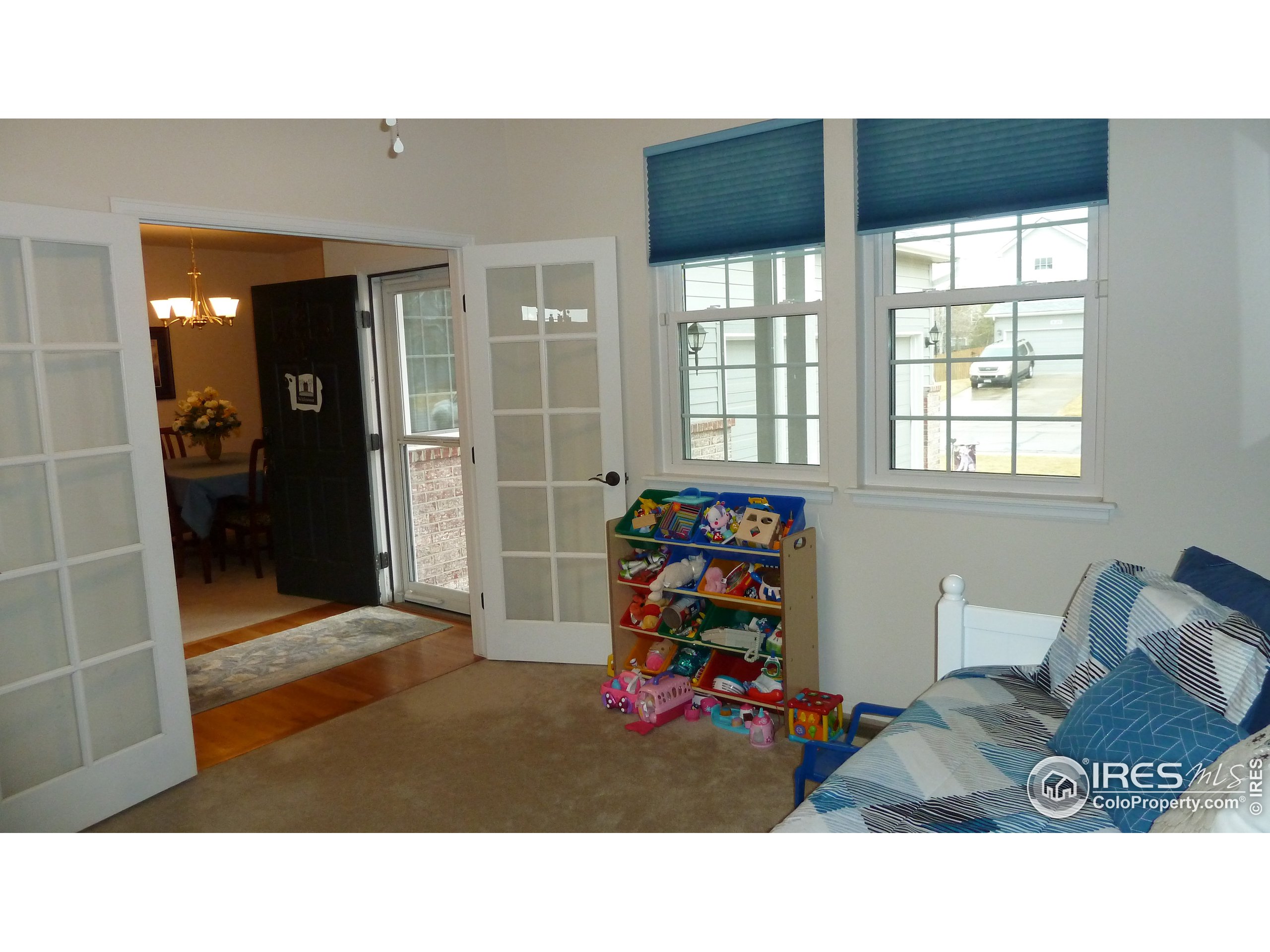 8121 Raspberry Drive Frederick, CO 80504 - Photo 14 of 38 a room with furniture and window