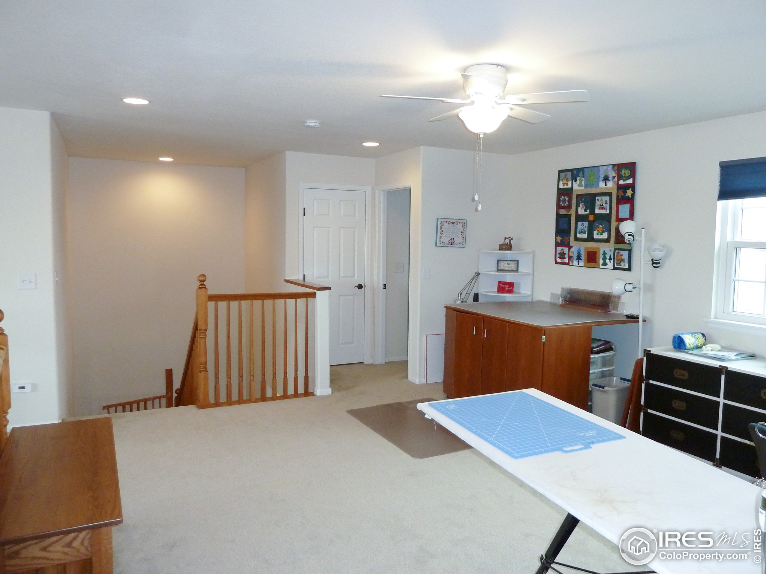 8121 Raspberry Drive Frederick, CO 80504 - Photo 18 of 38 a bedroom with a bed and a dresser