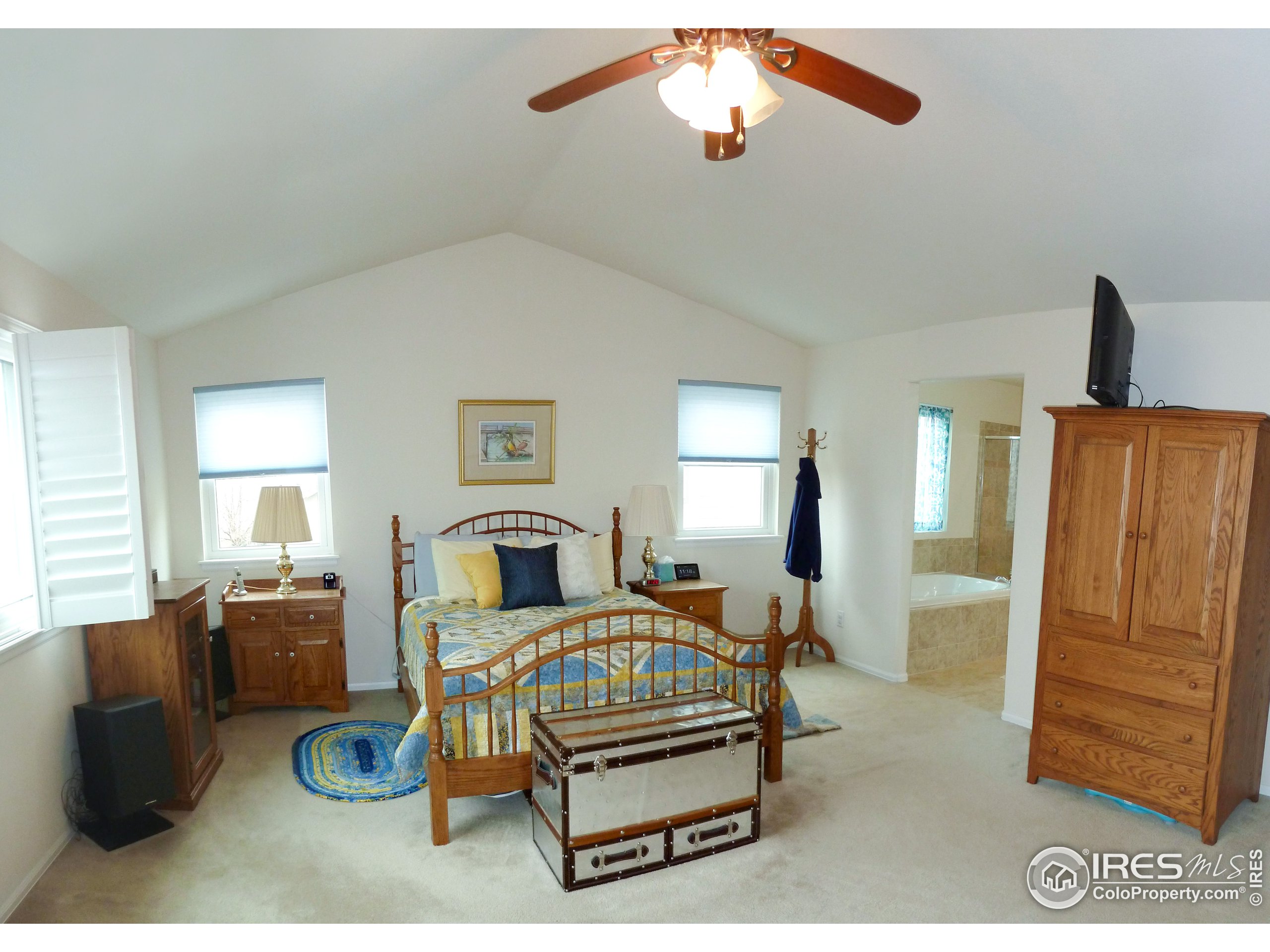 8121 Raspberry Drive Frederick, CO 80504 - Photo 20 of 38 a living room with furniture a flat screen tv and dresser