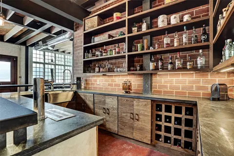 a view of a kitchen with a sink and a stove