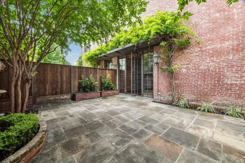 a view of a house with a backyard and a garden