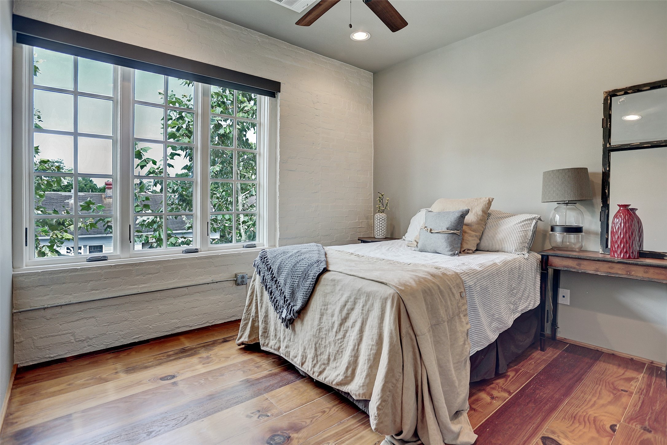 808 Coronado Street Houston, TX 77009 - Photo 18 of 50 a bedroom with a bed and window