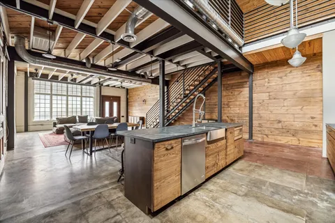 a view of hallway with wooden floor