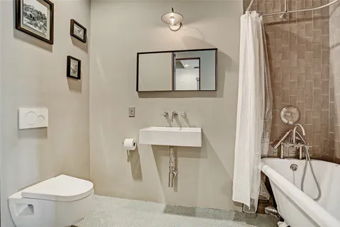 a bedroom with a bed and a desk