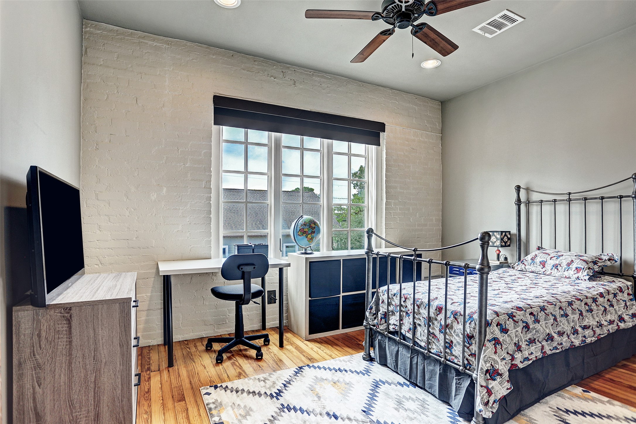 808 Coronado Street Houston, TX 77009 - Photo 45 of 50 a bedroom with a bed and a desk