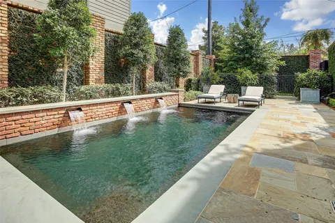 a view of a backyard with sitting area