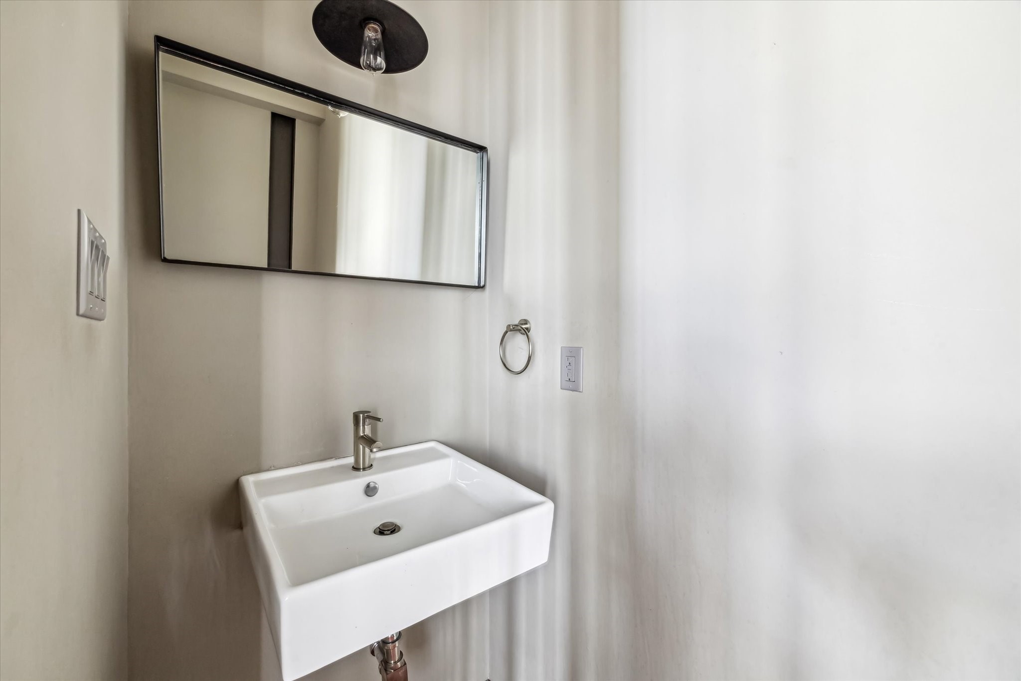 808 Coronado Street Houston, TX 77009 - Photo 8 of 50 a bathroom with a sink and a mirror