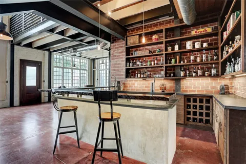 a kitchen with stainless steel appliances granite countertop a stove and cabinets