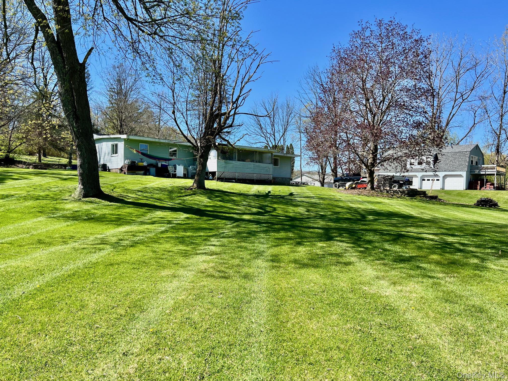 24 Wilson Eaton Road Amenia, NY 12501 - Photo 2 of 20 a view of a big yard with a house