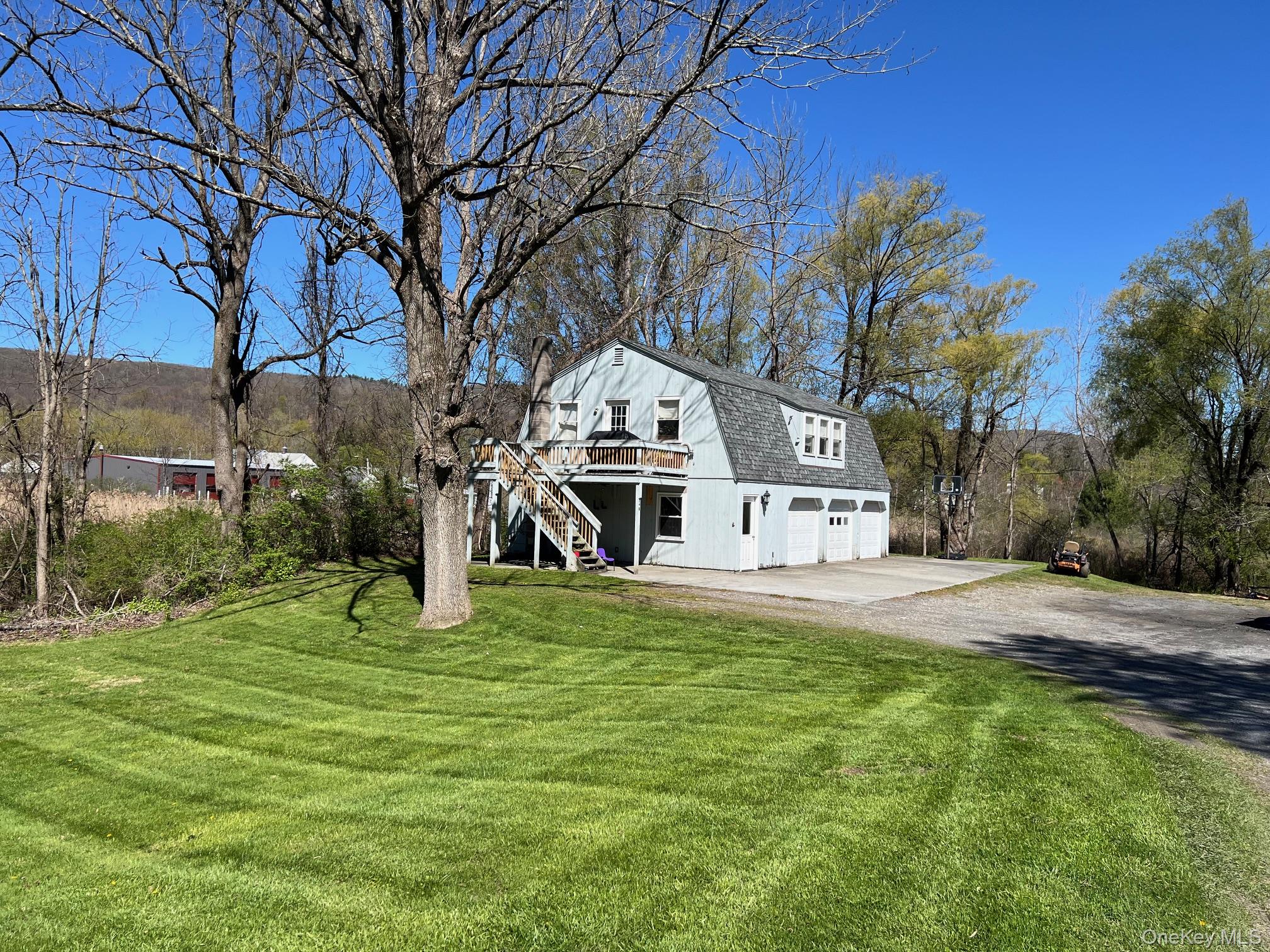 24 Wilson Eaton Road Amenia, NY 12501 - Photo 3 of 20 a front view of a house with a yard table and chairs