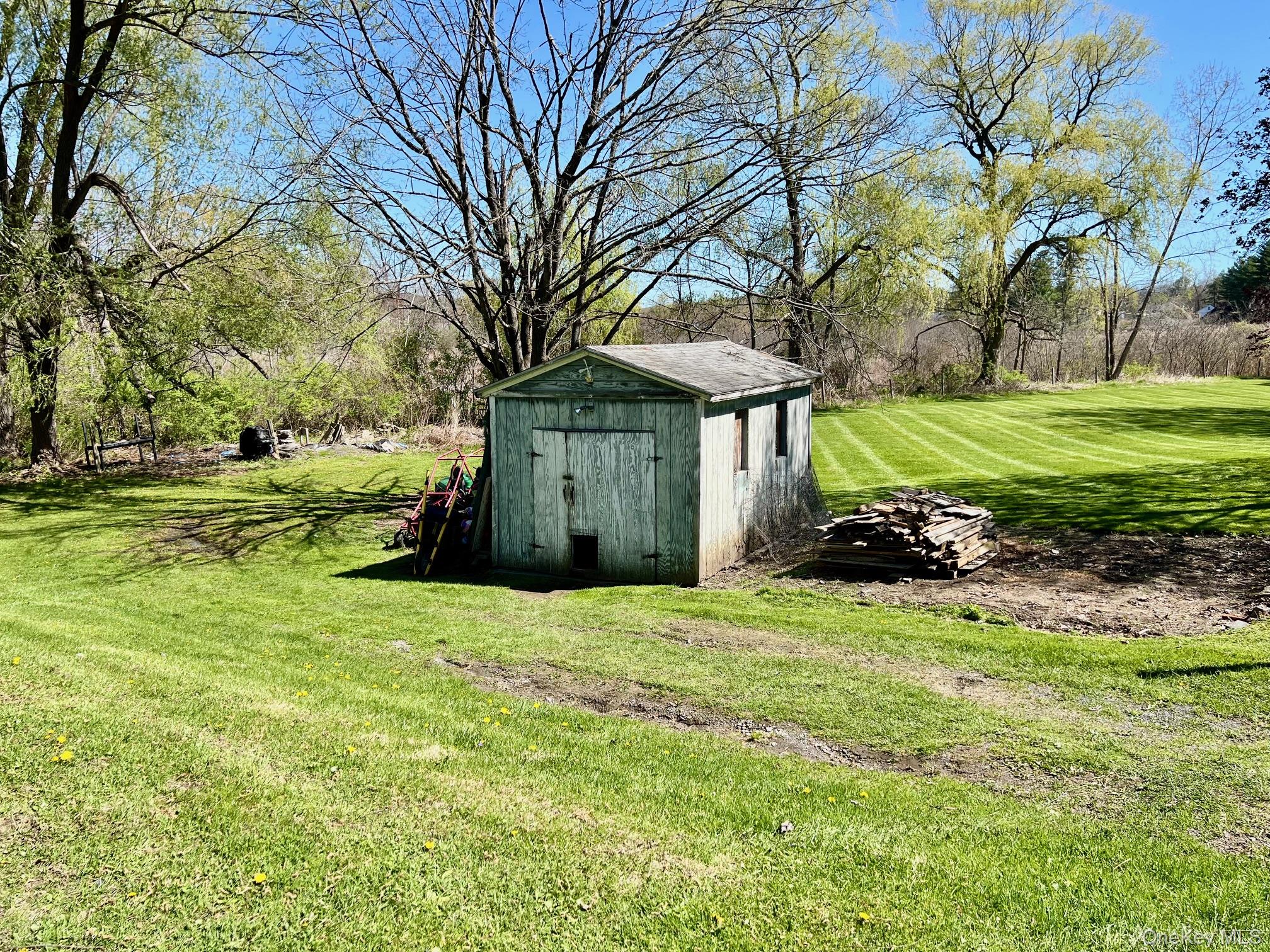 24 Wilson Eaton Road Amenia, NY 12501 - Photo 5 of 20 a view of a house with a yard and large trees