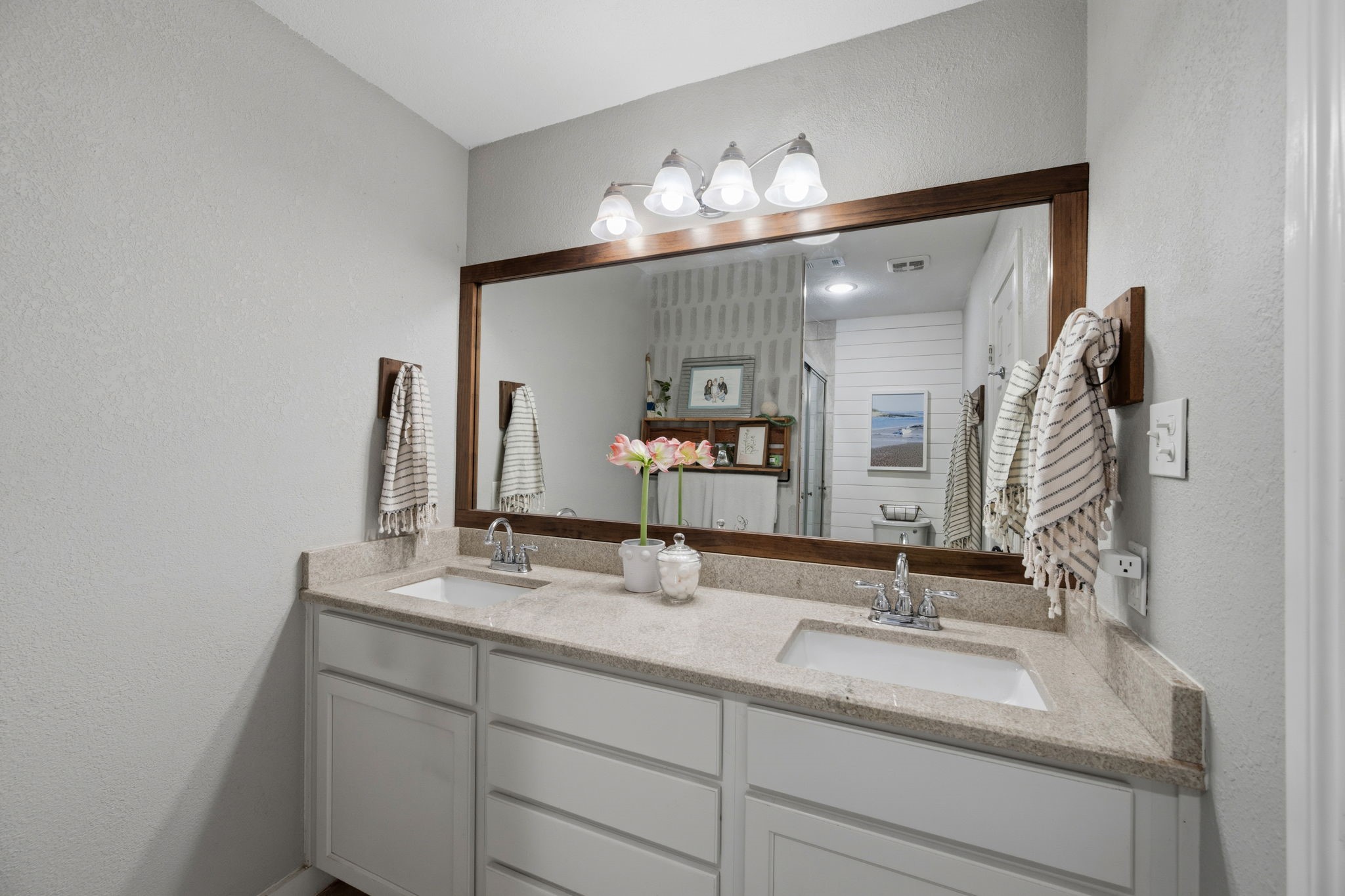 431 Corydon Drive Houston, TX 77336 - Photo 17 of 26 Primary bathroom featuring a spacious dual-sink vanity with generous counter space, a large framed mirror, and updated lighting. Abundant cabinetry offers excellent storage for everyday essentials.