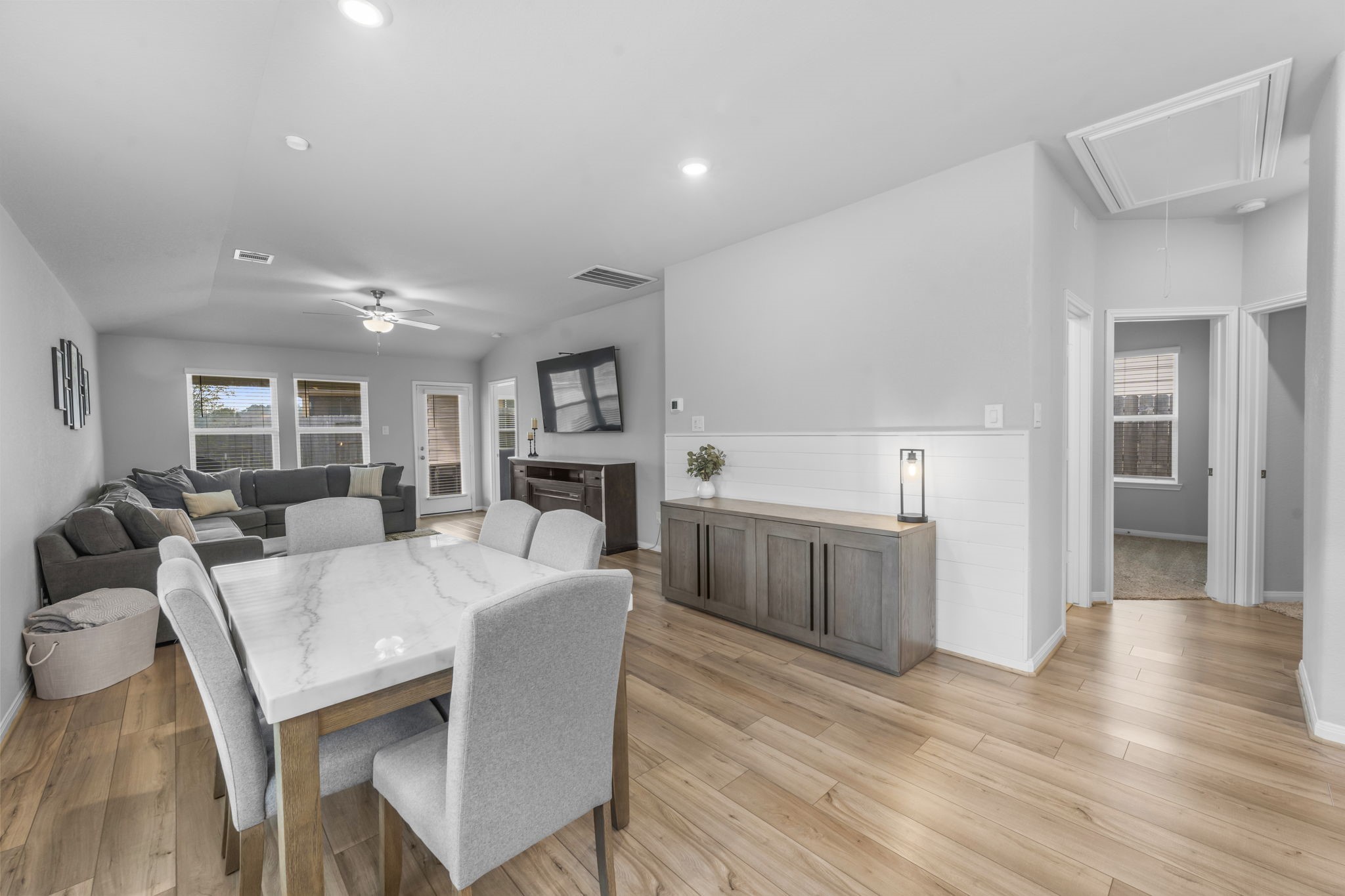 18581 Meadow Point Lane Montgomery, TX 77316 - Photo 13 of 44 a large white kitchen with cabinets a sink a counter space and stainless steel appliances