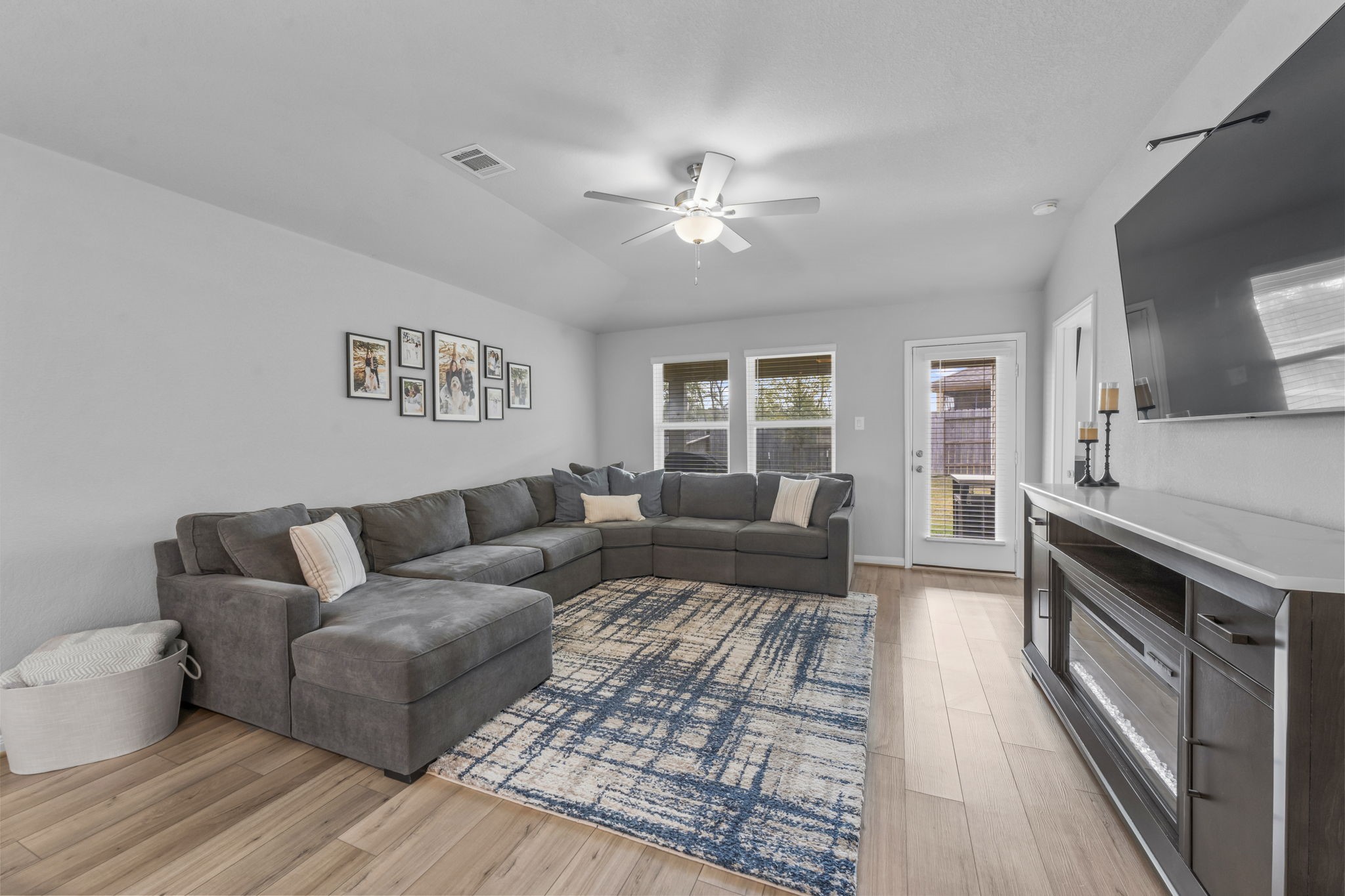 18581 Meadow Point Lane Montgomery, TX 77316 - Photo 16 of 44 a living room with furniture and a fireplace