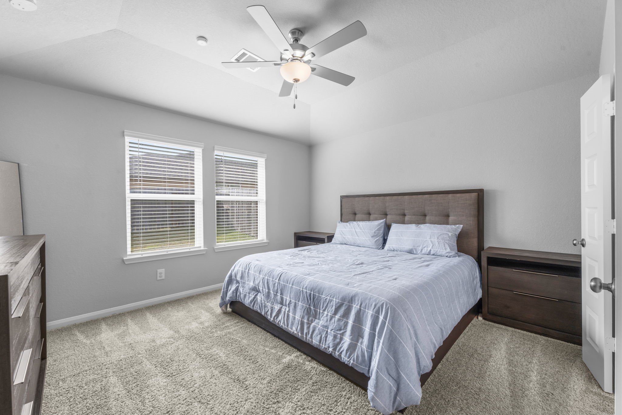 18581 Meadow Point Lane Montgomery, TX 77316 - Photo 18 of 44 a bedroom with a bed and a window