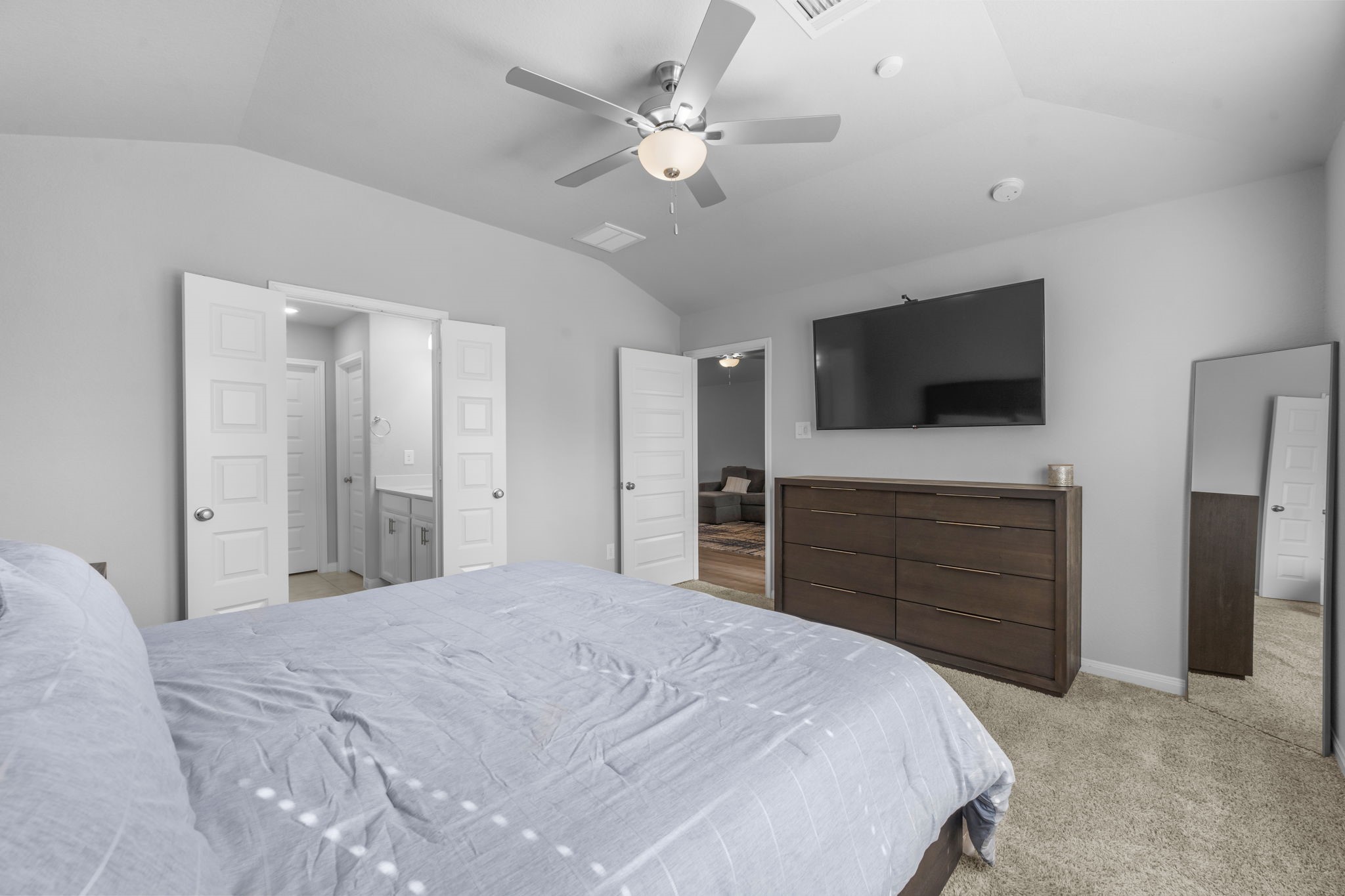 18581 Meadow Point Lane Montgomery, TX 77316 - Photo 19 of 44 a bedroom with a bed and a flat screen tv