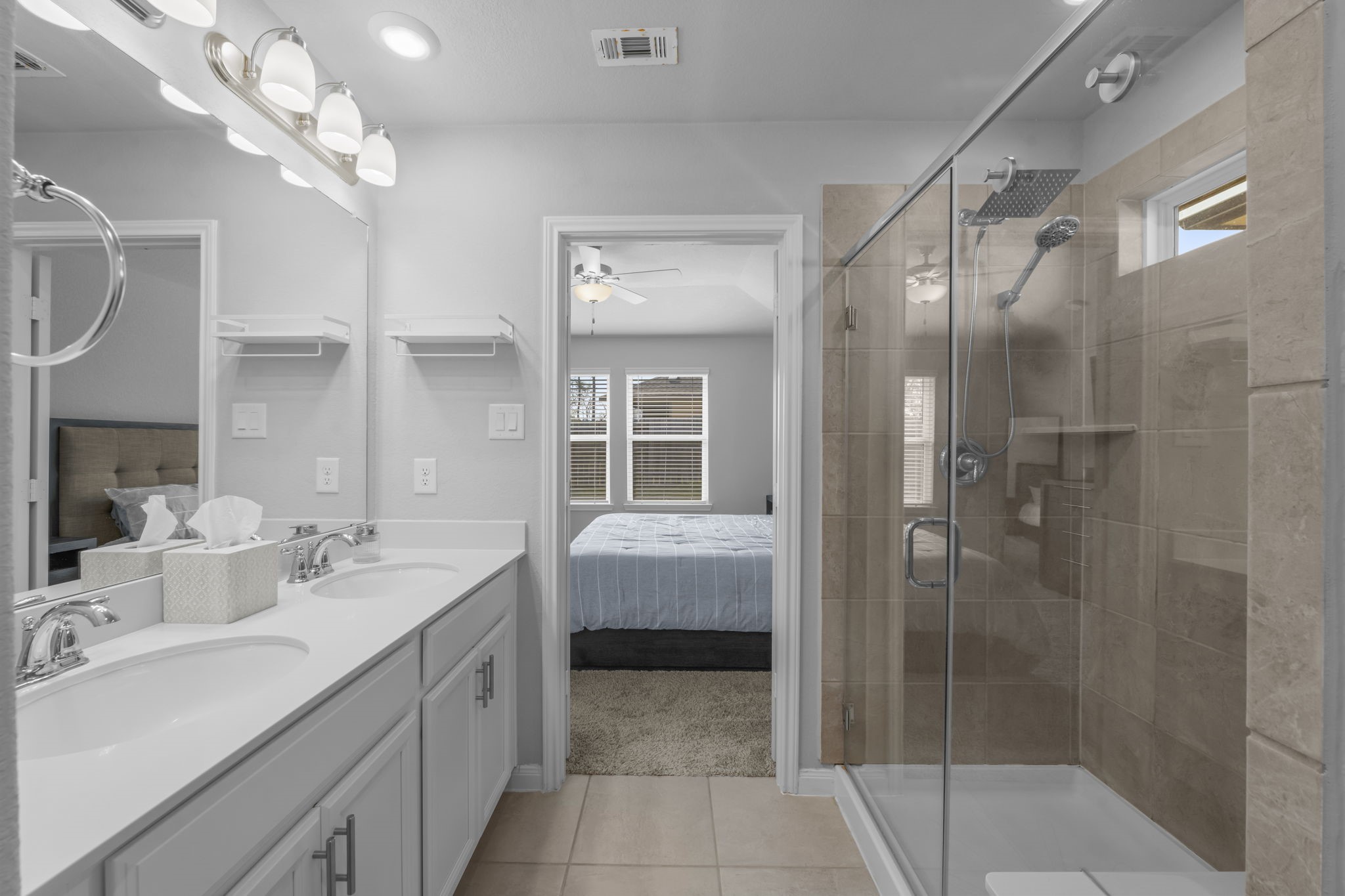 18581 Meadow Point Lane Montgomery, TX 77316 - Photo 23 of 44 a bathroom with a double vanity sink mirror and shower