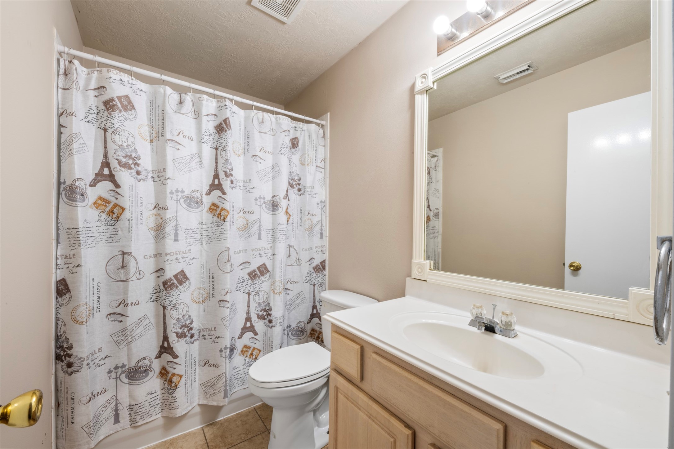 13615 Ambrose Street Houston, TX 77045 - Photo 17 of 35 a bathroom with a sink and a mirror