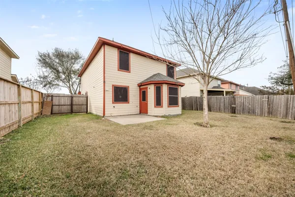 a view of a backyard with a house