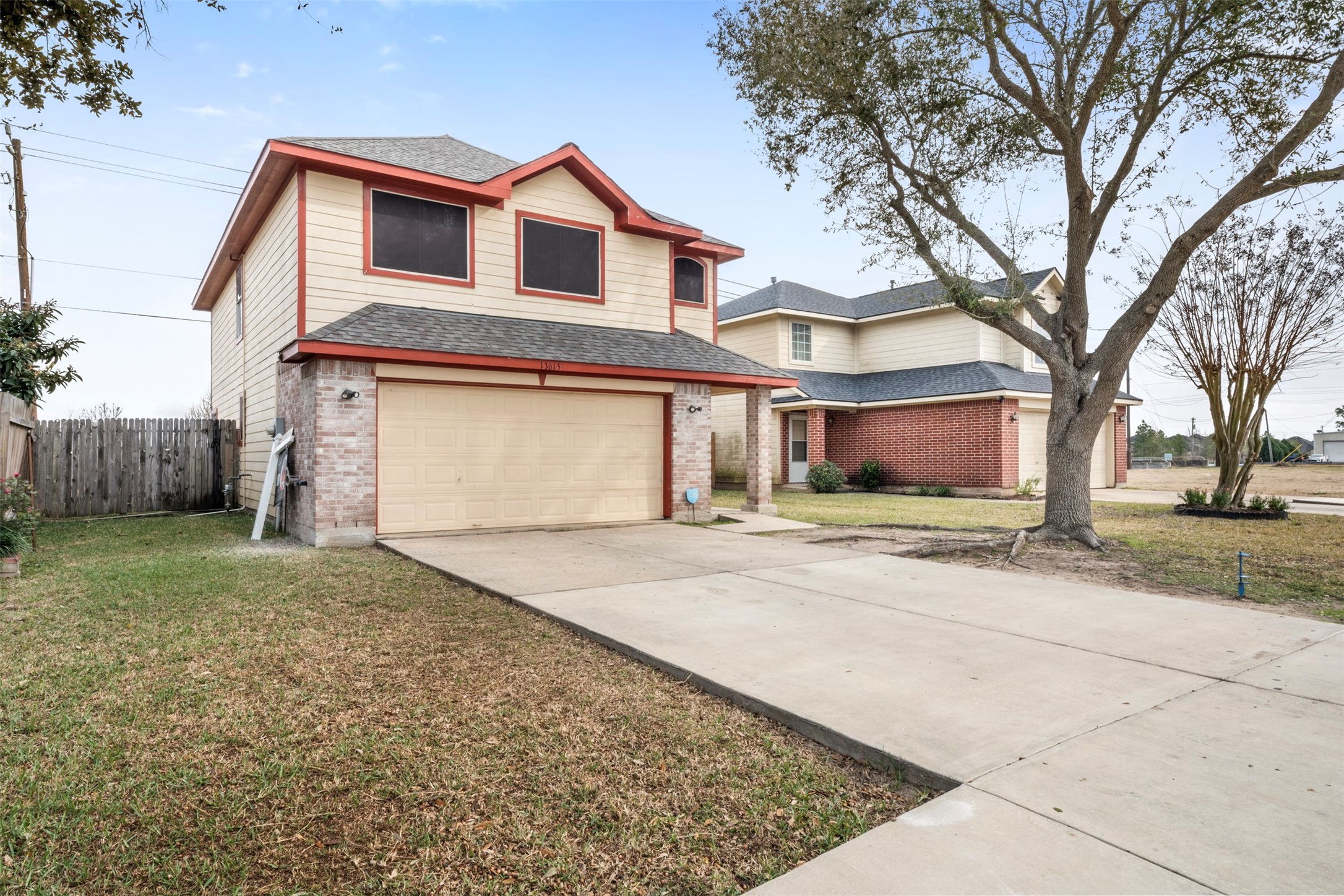13615 Ambrose Street Houston, TX 77045 - Photo 26 of 35 a front view of a house with a yard and garage