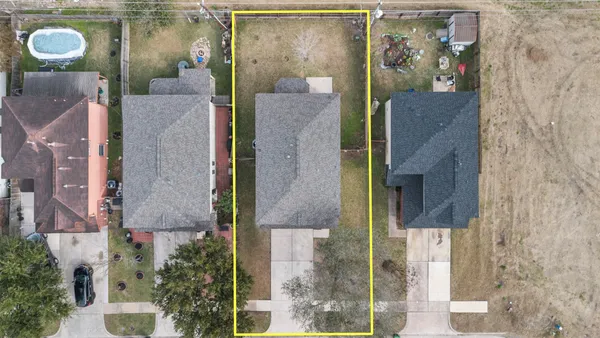 an aerial view of waterside house