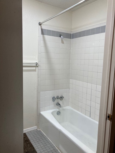 2306 East 8th Street, Unit 5 Austin, TX 78702 - Photo 6 of 9 a bathroom with a bathtub and shower
