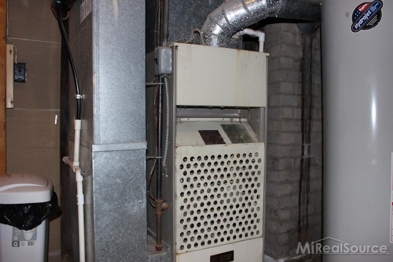 2936 Harvey Street Rochester, MI 48309 - Photo 27 of 29 All the mechanicals are located in a separate room in the basement. There is also ample laundry space in the basement.