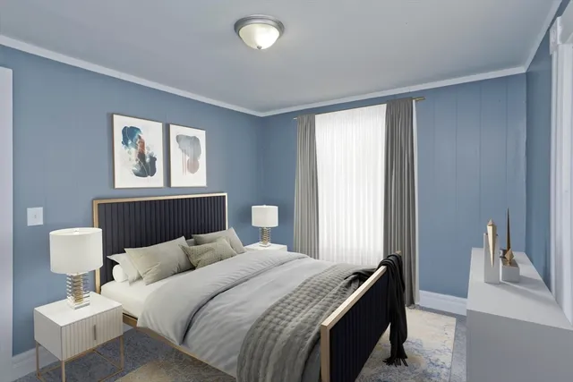 a bedroom with a bed and a lamp