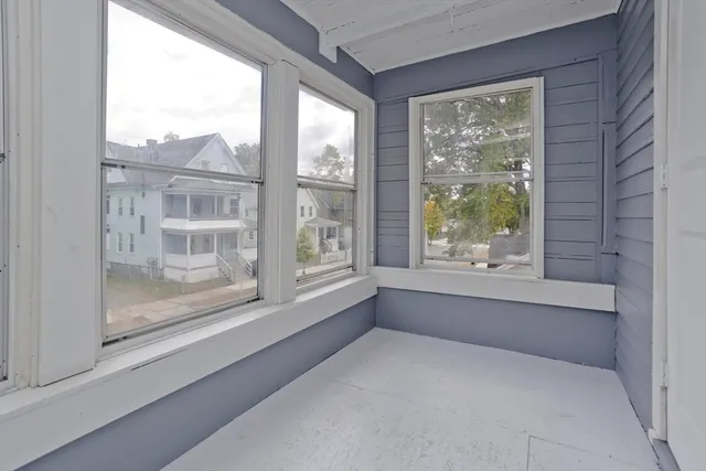 a bathroom with a large tub and shower