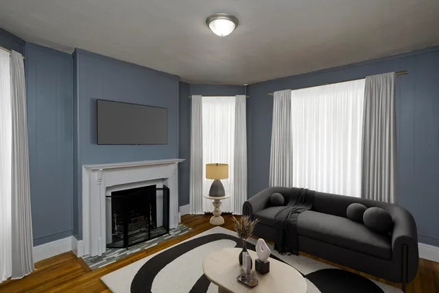 a living room with furniture and a fireplace